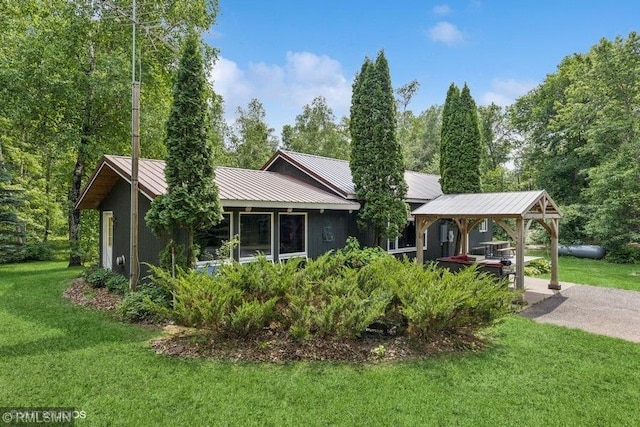 2818 Wilson Ave, Sterling Twp, WI 54024 - view of front of house featuring a front yard, a metal roof, and a gazebo