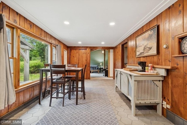 2818 Wilson Ave, Sterling Twp, WI 54024 - dining room featuring crown molding, wood walls, recessed lighting, and light tile patterned flooring
