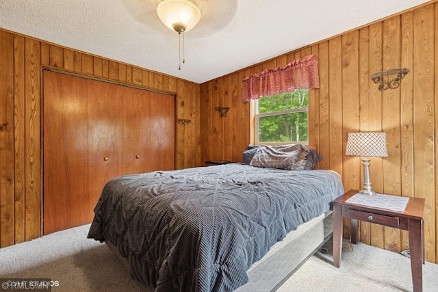2818 Wilson Ave, Sterling Twp, WI 54024 - carpeted bedroom with wood walls and a closet