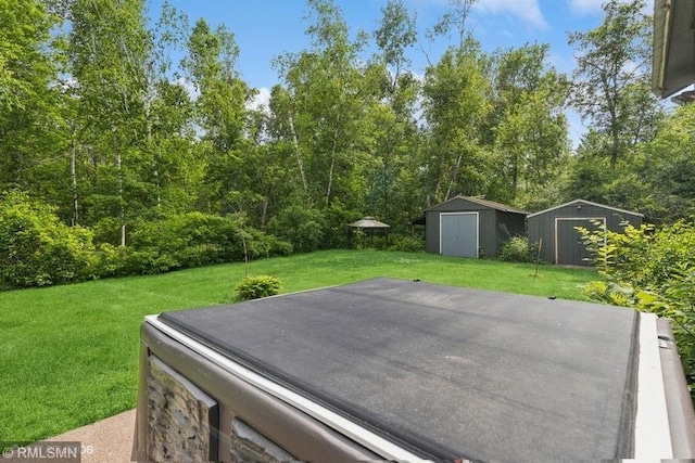 2818 Wilson Ave, Sterling Twp, WI 54024 - view of green lawn featuring a storage shed and a patio