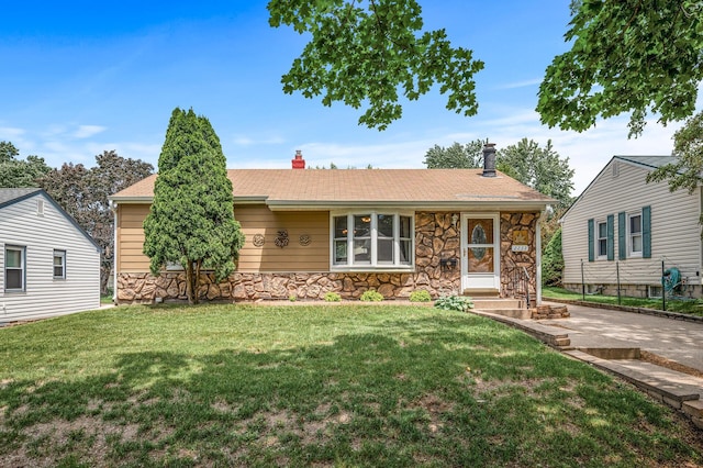 2233 Fremont Ave E, Saint Paul, MN 55119 - view of front facade with stone siding, a chimney, and a front yard