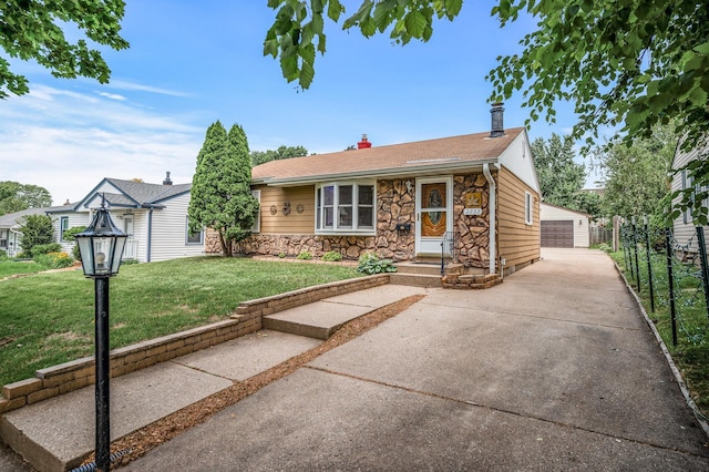 2233 Fremont Ave E, Saint Paul, MN 55119 - view of front of property featuring stone siding, a front yard, an outbuilding, a detached garage, and a chimney