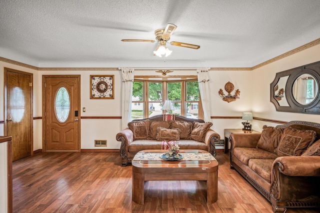 2233 Fremont Ave E, Saint Paul, MN 55119 - living room with a textured ceiling, plenty of natural light, a ceiling fan, wood finished floors, and crown molding