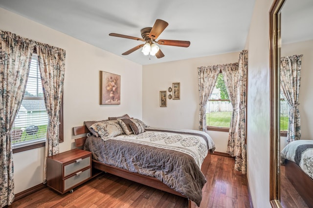 2233 Fremont Ave E, Saint Paul, MN 55119 - bedroom with multiple windows, wood finished floors, and a ceiling fan
