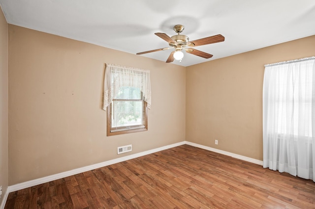 2233 Fremont Ave E, Saint Paul, MN 55119 - unfurnished room with wood finished floors and ceiling fan