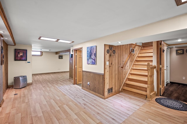 2233 Fremont Ave E, Saint Paul, MN 55119 - basement with wood finished floors, stairs, and wooden walls