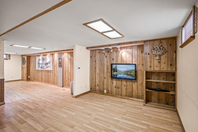2233 Fremont Ave E, Saint Paul, MN 55119 - unfurnished living room with wood walls and wood finished floors