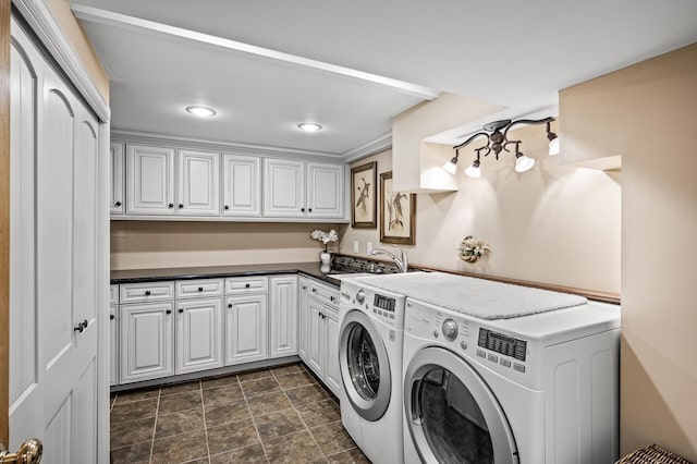 2233 Fremont Ave E, Saint Paul, MN 55119 - washroom featuring washer and clothes dryer, cabinet space, recessed lighting, and stone finish floors