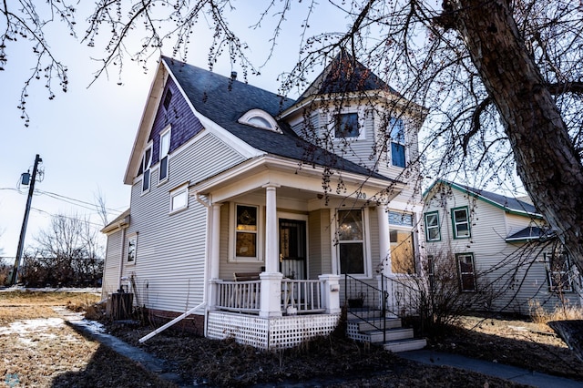320 Elm St, Crookston, MN 56716 - victorian home with a porch and a shingled roof
