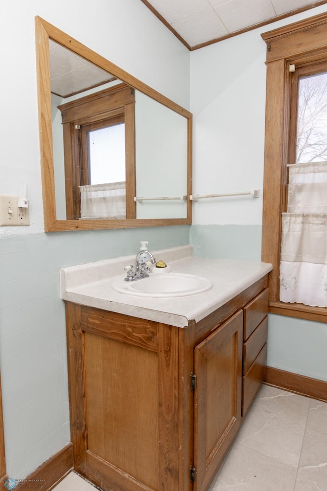 320 Elm St, Crookston, MN 56716 - bathroom featuring vanity and crown molding