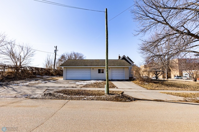 320 Elm St, Crookston, MN 56716 - view of front of home featuring driveway and a garage