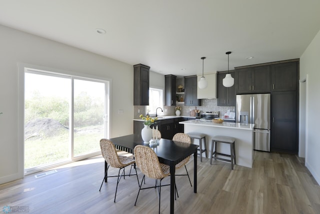 1276 Marlys Dr W, West Fargo, ND 58078 - dining area featuring light wood-style flooring and recessed lighting