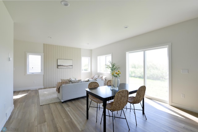 1276 Marlys Dr W, West Fargo, ND 58078 - dining room featuring light wood-style flooring and plenty of natural light