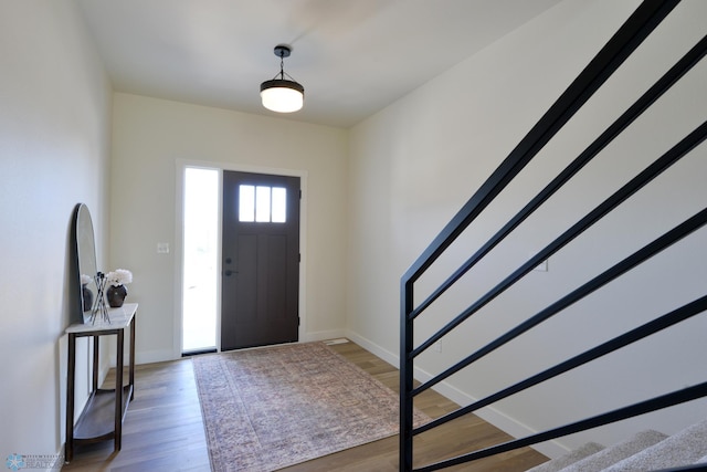 1276 Marlys Dr W, West Fargo, ND 58078 - foyer entrance featuring stairway and light wood finished floors