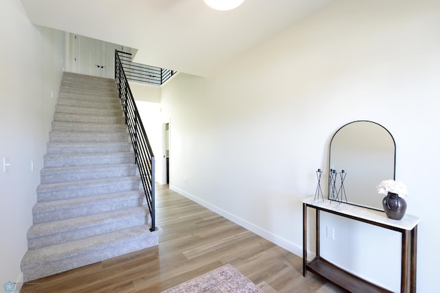 1276 Marlys Dr W, West Fargo, ND 58078 - stairs with wood finished floors and baseboards