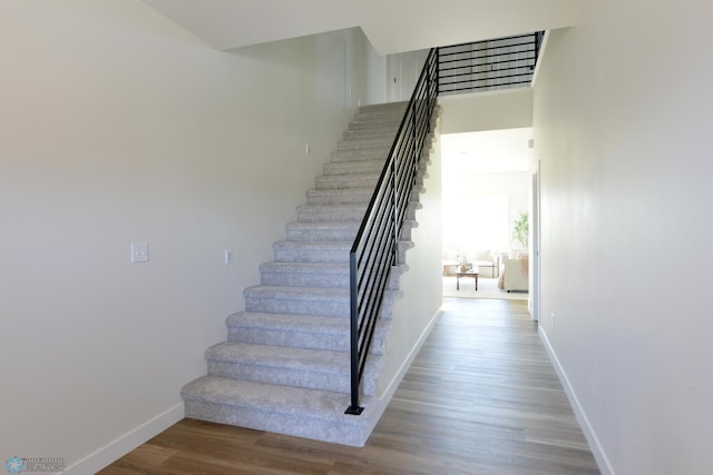 1276 Marlys Dr W, West Fargo, ND 58078 - stairway with wood finished floors and baseboards