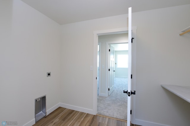 1276 Marlys Dr W, West Fargo, ND 58078 - washroom featuring hookup for an electric dryer and wood finished floors