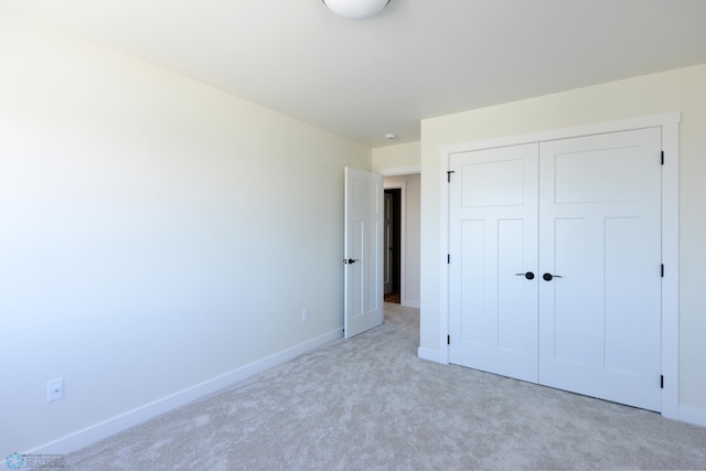 1276 Marlys Dr W, West Fargo, ND 58078 - unfurnished bedroom featuring light colored carpet and a closet