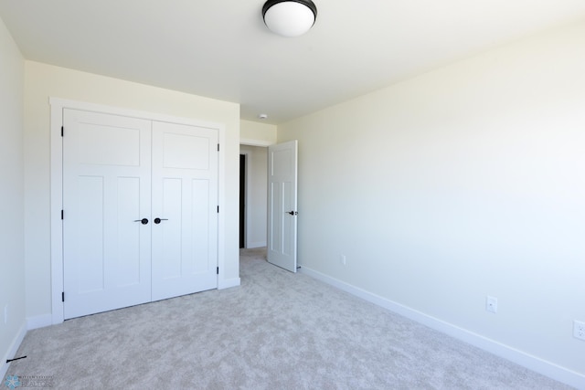 1276 Marlys Dr W, West Fargo, ND 58078 - unfurnished bedroom featuring a closet and light colored carpet