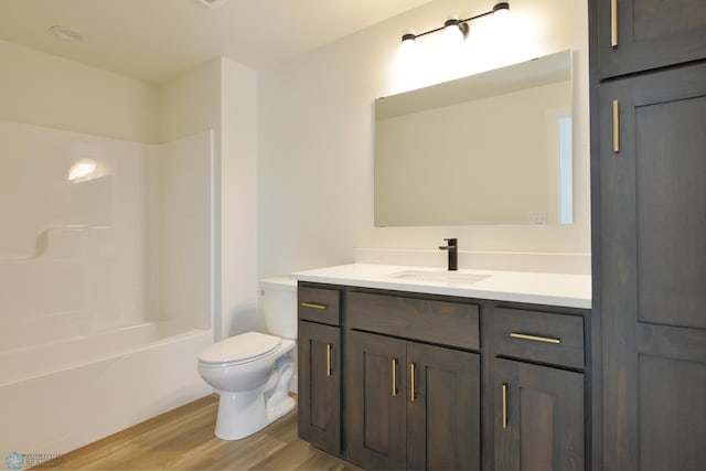 1276 Marlys Dr W, West Fargo, ND 58078 - full bathroom with vanity, wood finished floors, and bathtub / shower combination