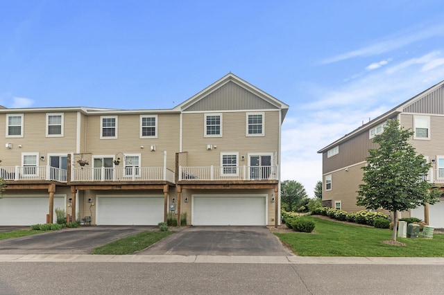 7558 Woods Edge Blvd, Lino Lakes, MN 55014 - townhome / multi-family property with driveway, a garage, and a front lawn