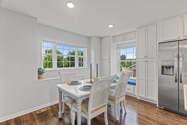 7558 Woods Edge Blvd, Lino Lakes, MN 55014 - dining space featuring dark wood finished floors, recessed lighting, and a textured ceiling
