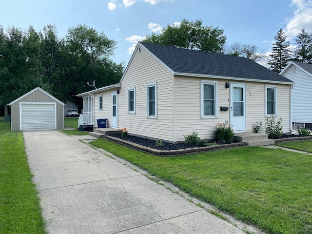 108 20th St S, Benson, MN 56215 - view of front of home featuring an outbuilding, a detached garage, driveway, a shingled roof, and a front yard