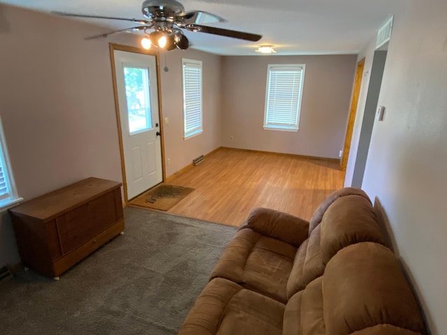 108 20th St S, Benson, MN 56215 - living area with ceiling fan and wood finished floors
