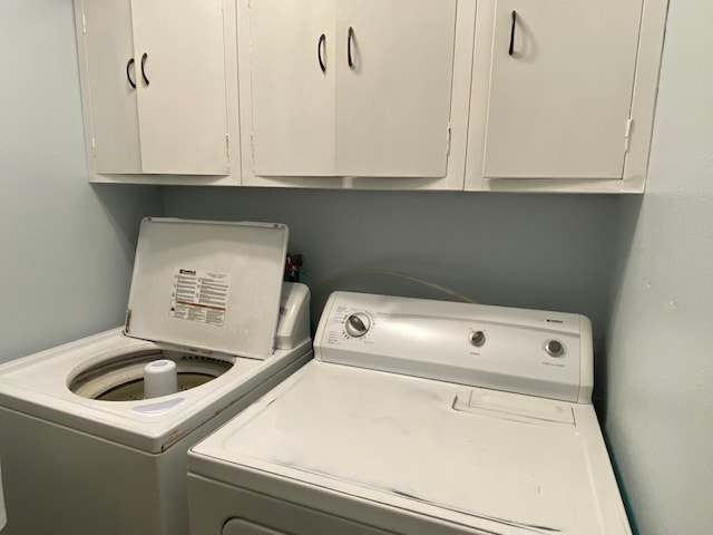 108 20th St S, Benson, MN 56215 - washroom featuring washer and clothes dryer and cabinet space