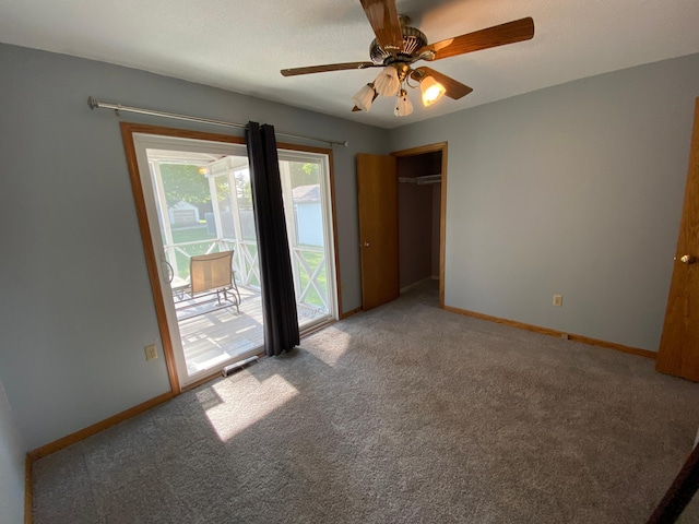 108 20th St S, Benson, MN 56215 - unfurnished bedroom featuring access to outside, carpet, a closet, and a ceiling fan