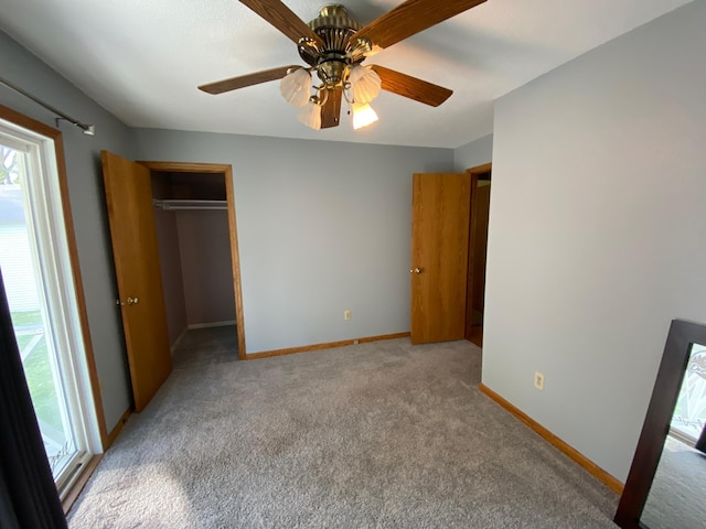 108 20th St S, Benson, MN 56215 - unfurnished bedroom featuring light carpet, a spacious closet, ceiling fan, and a closet