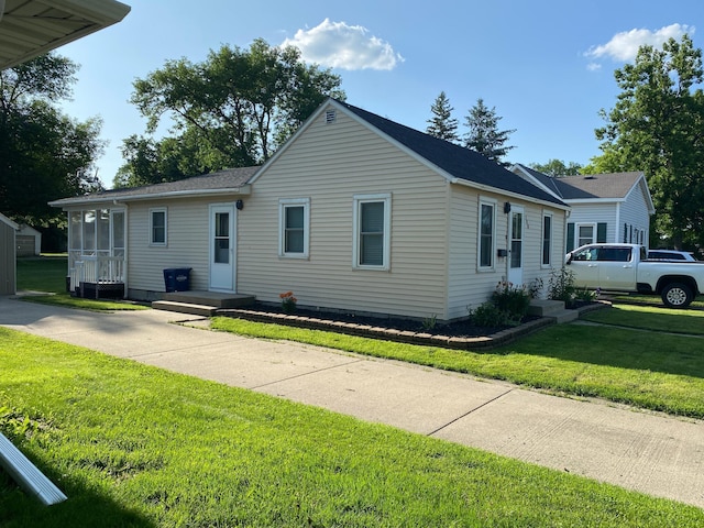 108 20th St S, Benson, MN 56215 - view of front of home featuring a front lawn and roof with shingles