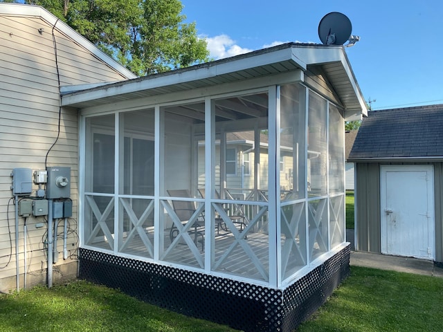 108 20th St S, Benson, MN 56215 - view of property exterior with a sunroom and a storage shed