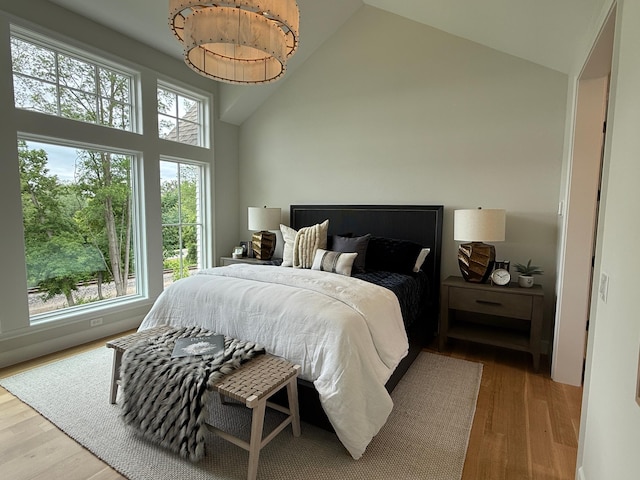 1038 Lake St E, Wayzata, MN 55391 - bedroom with high vaulted ceiling and wood finished floors