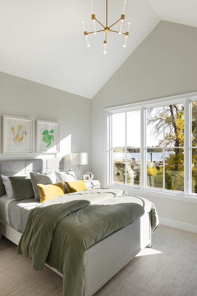 1038 Lake St E, Wayzata, MN 55391 - carpeted bedroom featuring a chandelier, multiple windows, and high vaulted ceiling
