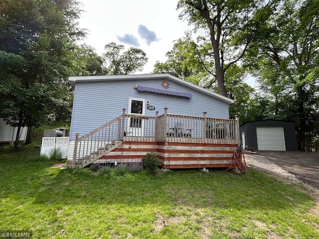 13648 Campfire Cir, South Haven, MN 55382 - view of front of property with an outdoor structure, a front yard, asphalt driveway, and a deck