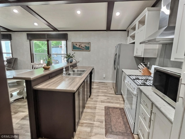 13648 Campfire Cir, South Haven, MN 55382 - kitchen featuring wall chimney range hood, gas range gas stove, stainless steel microwave, a center island with sink, and light wood-type flooring