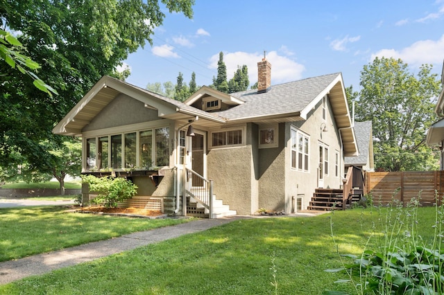 1339 Sargent Ave, Saint Paul, MN 55105 - view of front facade featuring stucco siding, a chimney, a sunroom, stairway, and roof with shingles