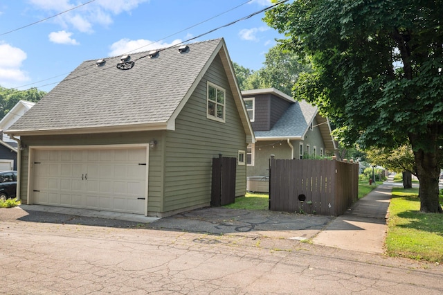 1339 Sargent Ave, Saint Paul, MN 55105 - view of property exterior with a shingled roof and a garage