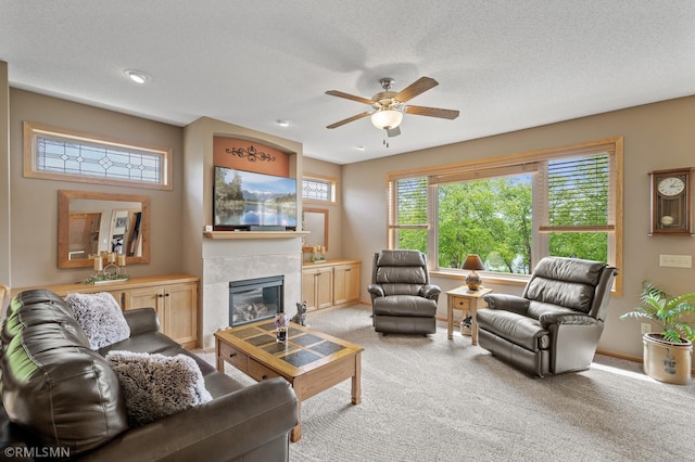 6831 Centerville Rd, Centerville, MN 55038 - living area with ceiling fan, light colored carpet, and a tile fireplace