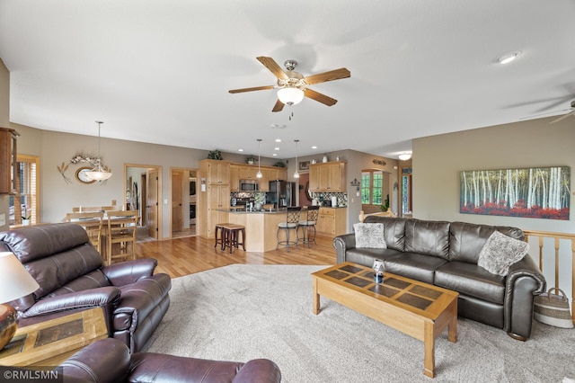 6831 Centerville Rd, Centerville, MN 55038 - living area with ceiling fan, light wood finished floors, and recessed lighting