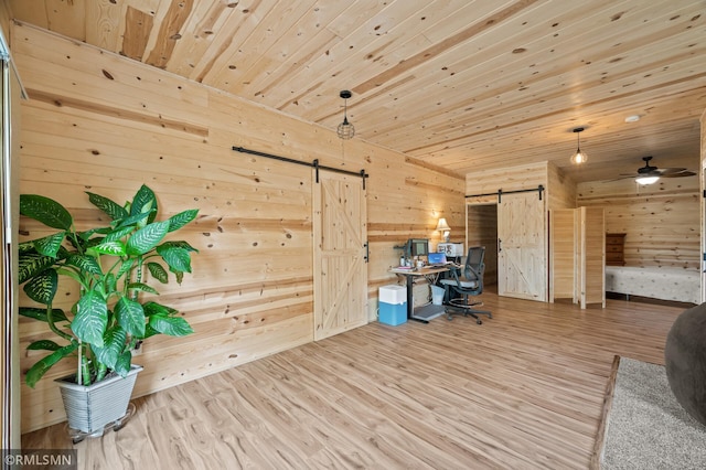 6831 Centerville Rd, Centerville, MN 55038 - office area with a barn door, wood walls, wood finished floors, wood ceiling, and ceiling fan