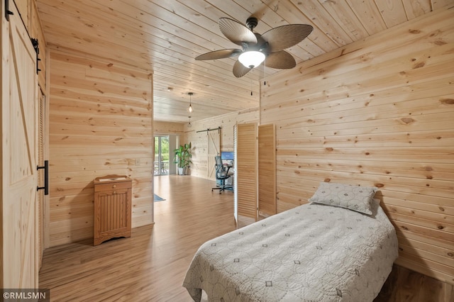 6831 Centerville Rd, Centerville, MN 55038 - bedroom with wooden ceiling, wood walls, light wood-style flooring, and vaulted ceiling