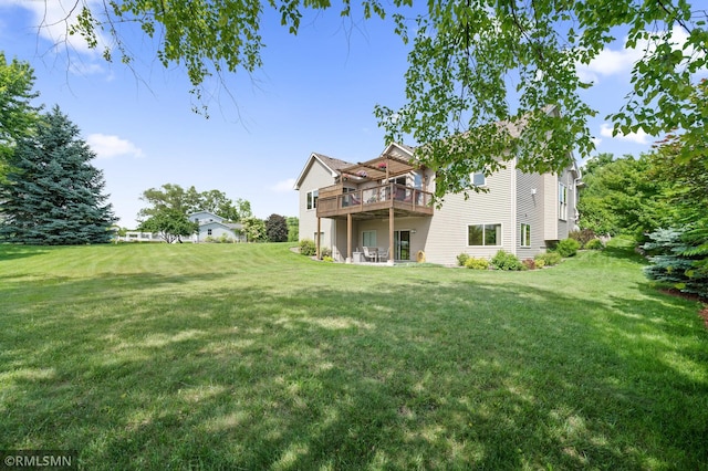 6831 Centerville Rd, Centerville, MN 55038 - view of grassy yard featuring a wooden deck and a patio