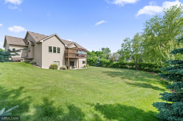 6831 Centerville Rd, Centerville, MN 55038 - view of green lawn featuring a deck
