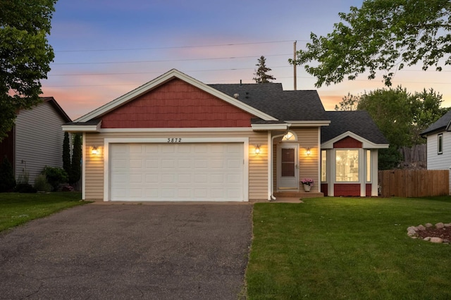 3872 Westbury Ln, Eagan, MN 55123 - view of front of home featuring asphalt driveway, a garage, and roof with shingles