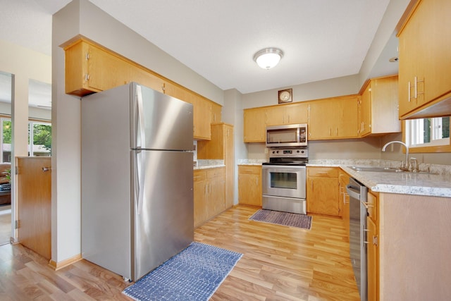 124 Willow Dr SW, Saint Michael, MN 55376 - kitchen with stainless steel appliances and light wood-type flooring