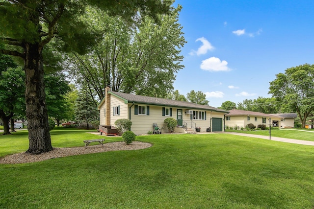 124 Willow Dr SW, Saint Michael, MN 55376 - ranch-style home with an attached garage, a chimney, concrete driveway, and a front yard