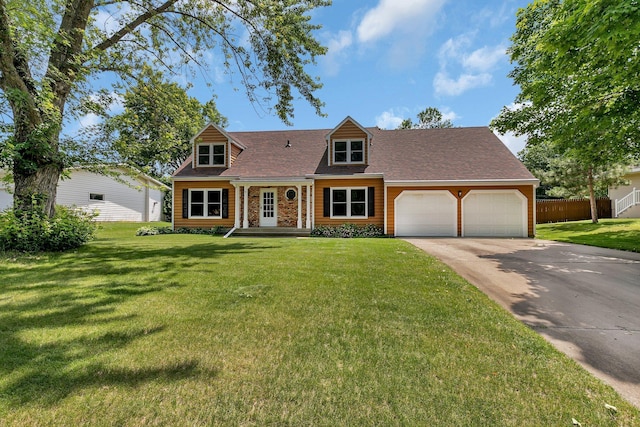 1044 Borgert Ave, Saint Cloud, MN 56303 - cape cod-style house featuring an attached garage, driveway, and a shingled roof