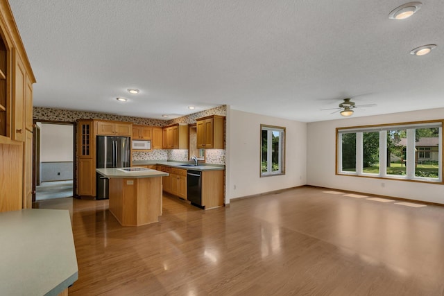 1044 Borgert Ave, Saint Cloud, MN 56303 - kitchen featuring dishwasher, white microwave, open floor plan, a textured ceiling, and a ceiling fan